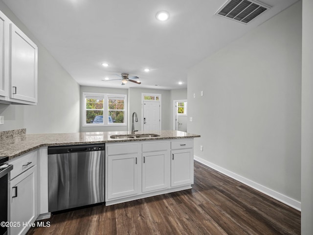 kitchen featuring stainless steel appliances, kitchen peninsula, sink, and white cabinets