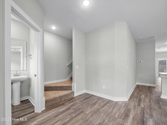 interior space featuring wood-type flooring and sink