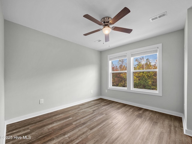 empty room featuring ceiling fan and wood-type flooring