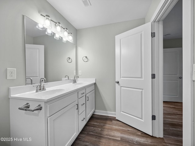 bathroom with vanity and hardwood / wood-style floors