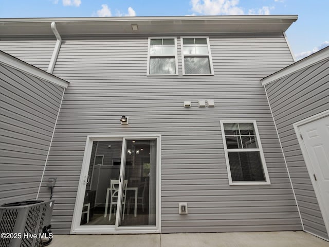 property entrance featuring central AC and a patio area