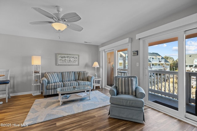 living room with hardwood / wood-style floors and ceiling fan