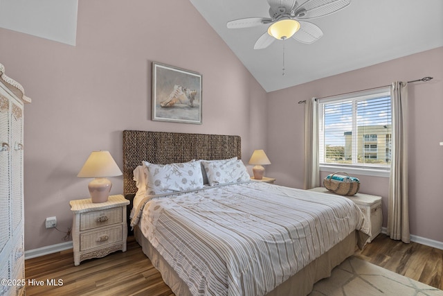 bedroom featuring hardwood / wood-style floors, ceiling fan, and lofted ceiling