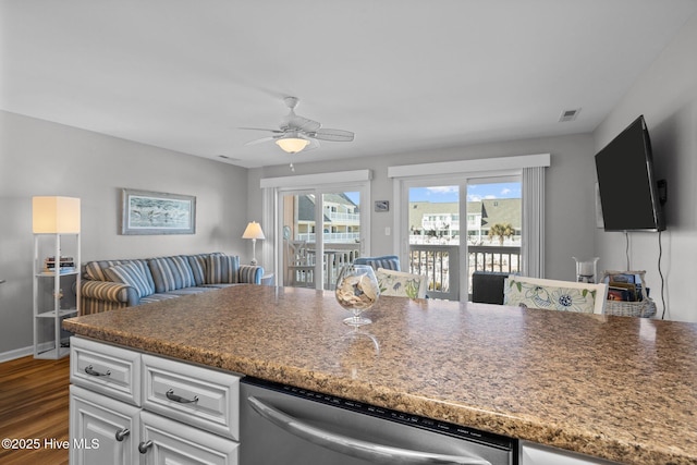 kitchen featuring white cabinetry, dishwasher, ceiling fan, and dark hardwood / wood-style floors