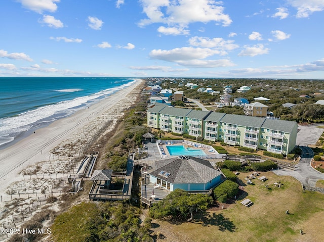 aerial view with a water view and a beach view