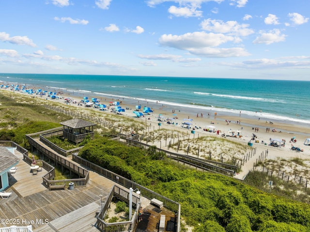 drone / aerial view with a beach view and a water view