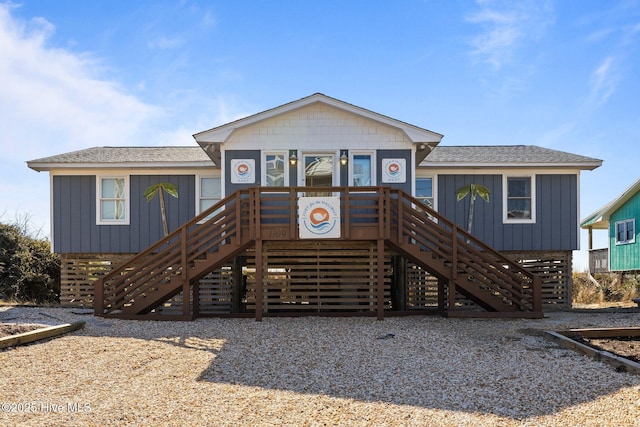 birds eye view of property featuring a beach view and a water view