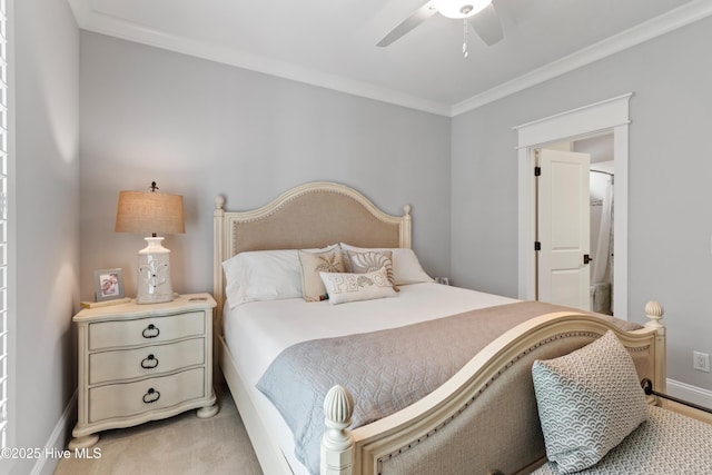 carpeted bedroom featuring ceiling fan and ornamental molding