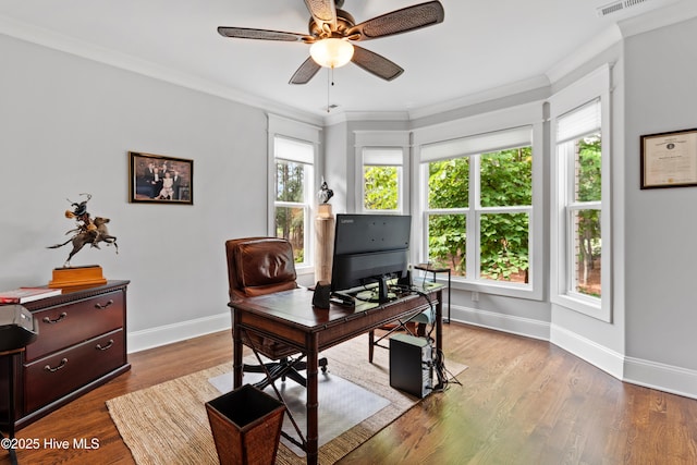 home office featuring light hardwood / wood-style floors, ceiling fan, and crown molding