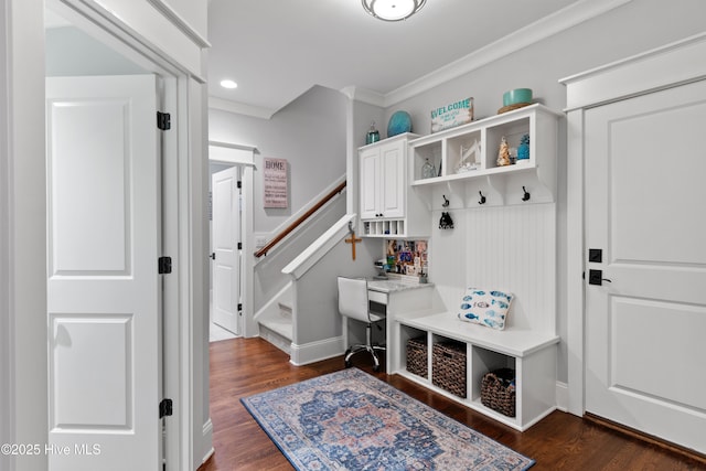 mudroom with crown molding and dark wood-type flooring