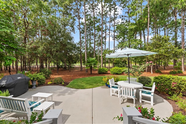 view of patio featuring a grill