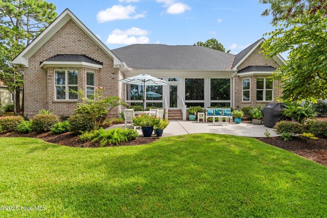 view of home's community with a yard