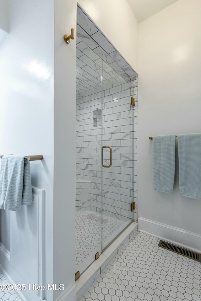 bathroom featuring tile patterned floors and walk in shower