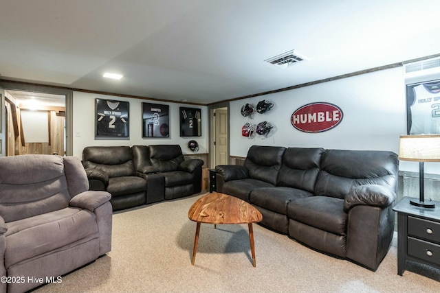 carpeted living room with ornamental molding