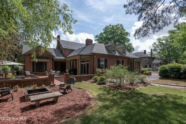 back of property featuring a yard and a patio