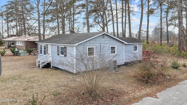 view of side of home featuring cooling unit