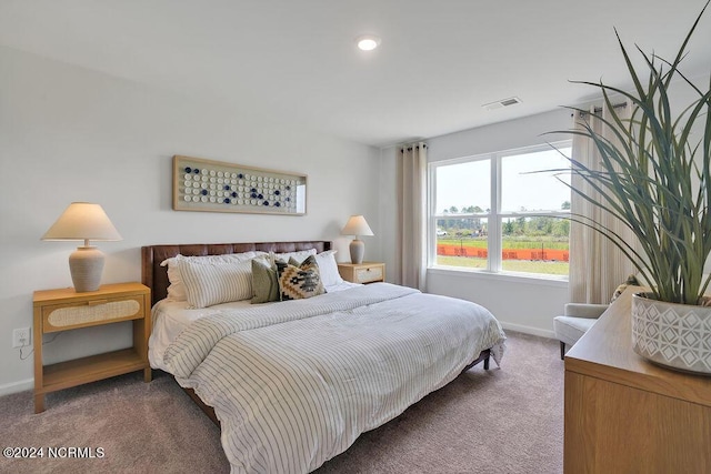 bedroom featuring carpet floors, baseboards, and visible vents