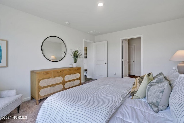 carpeted bedroom featuring baseboards