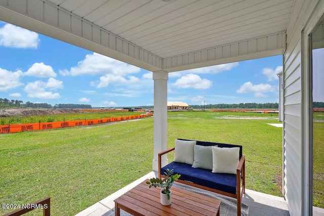 view of yard featuring a rural view and an outdoor hangout area