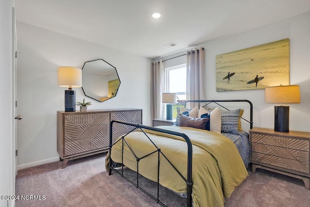 bedroom with recessed lighting, carpet flooring, visible vents, and baseboards