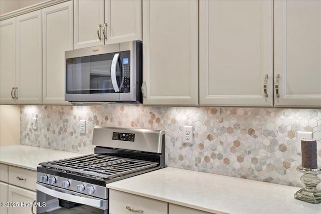 kitchen featuring backsplash and appliances with stainless steel finishes