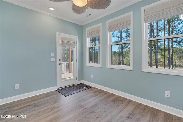 interior space featuring crown molding, hardwood / wood-style floors, and ceiling fan