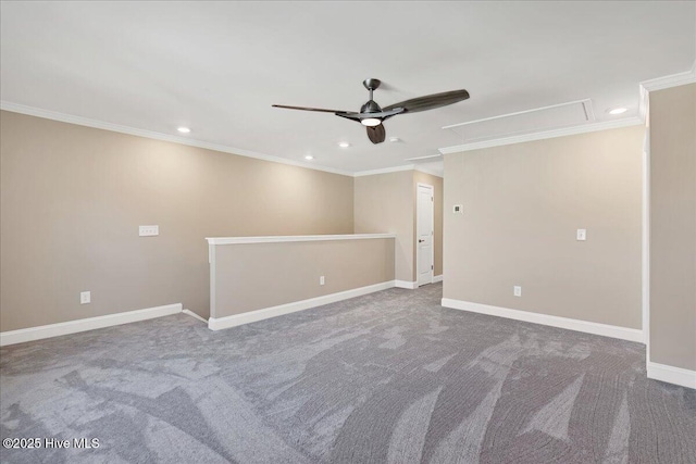 carpeted spare room with ceiling fan and crown molding