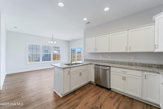 kitchen featuring white cabinetry, stainless steel dishwasher, kitchen peninsula, and sink