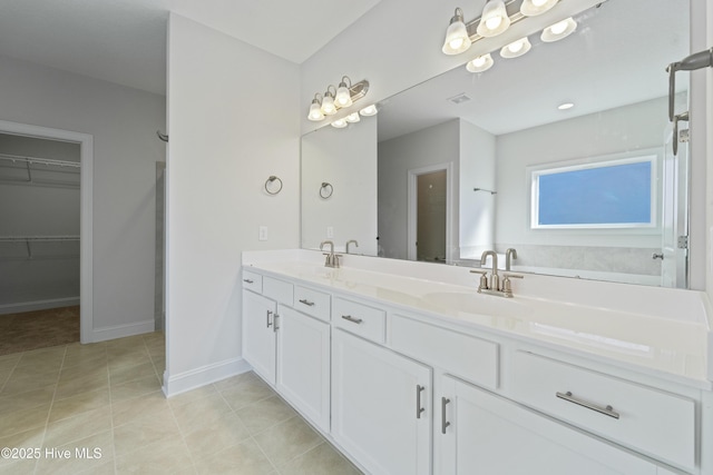 bathroom with vanity and tile patterned floors