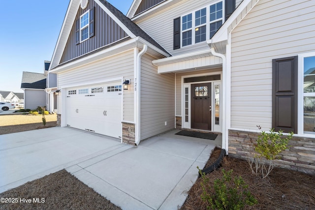 view of exterior entry featuring a garage