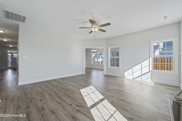 unfurnished living room featuring ceiling fan and wood-type flooring