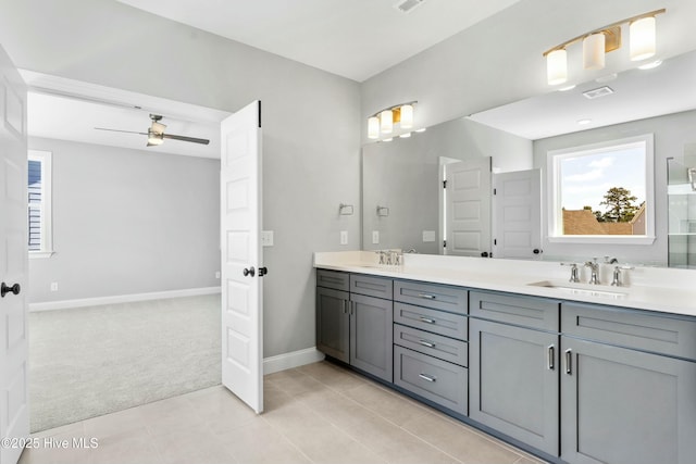 bathroom featuring ceiling fan, vanity, and tile patterned flooring