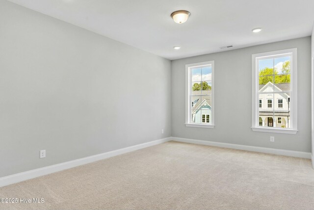 unfurnished bedroom featuring ceiling fan and light colored carpet