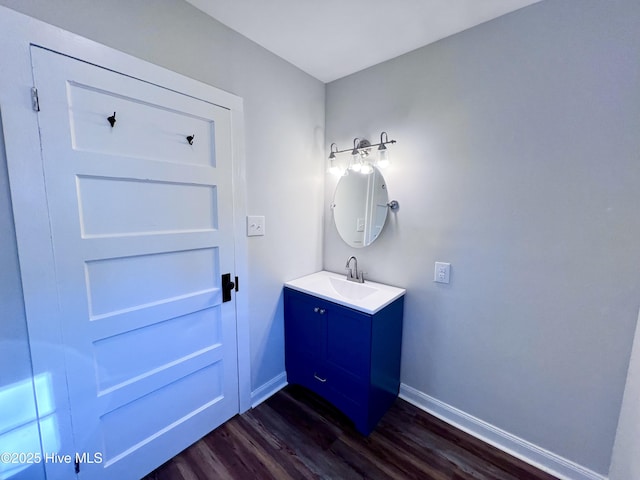 bathroom with hardwood / wood-style flooring and vanity