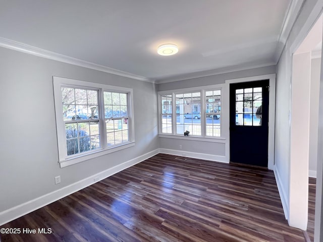 interior space featuring dark hardwood / wood-style flooring and crown molding