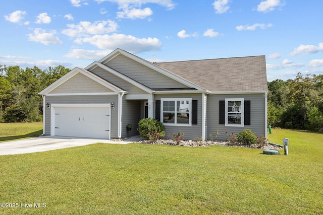 view of front facade with a garage and a front lawn