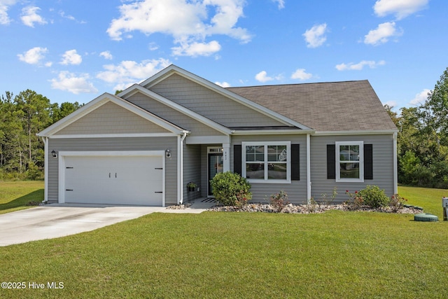 view of front of property featuring a garage and a front lawn