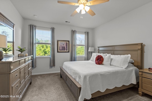 bedroom with light carpet and ceiling fan