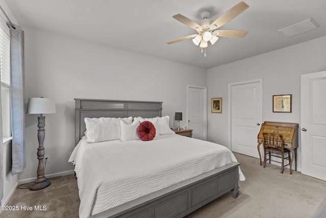 carpeted bedroom with ceiling fan