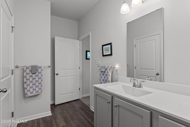 bathroom with hardwood / wood-style flooring and vanity