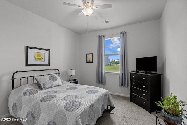 bedroom featuring ceiling fan and light colored carpet