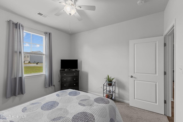 bedroom featuring ceiling fan and light colored carpet