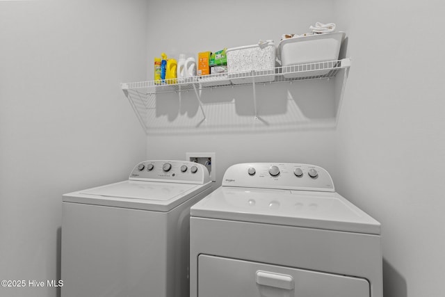 laundry area with washing machine and clothes dryer