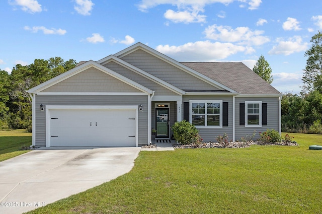 view of front of home with a garage and a front yard