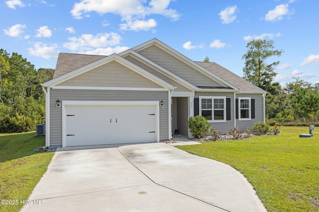 view of front of property with a garage and a front lawn