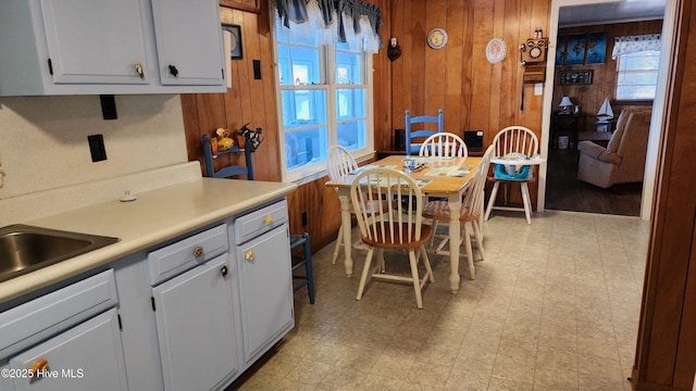 kitchen featuring wood walls