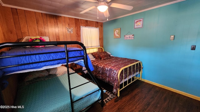 bedroom featuring ceiling fan, dark hardwood / wood-style floors, and ornamental molding