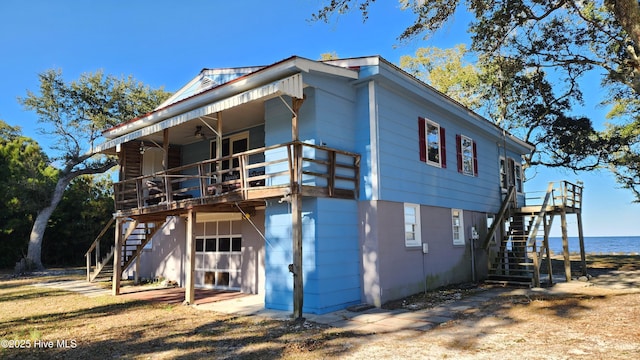 back of house with a water view