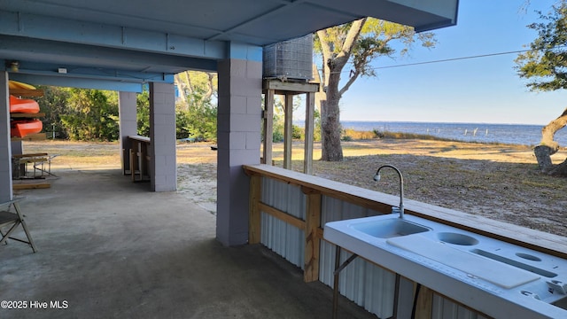 view of patio / terrace with a water view