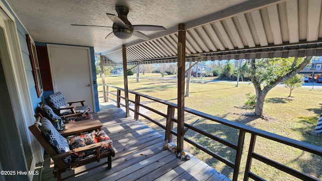 wooden deck featuring ceiling fan and a porch